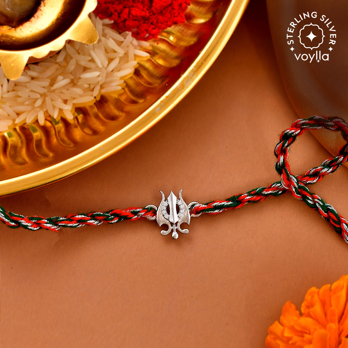 Minimalist 925 sterling silver thread rakhi with sleek silver charms, combining simplicity and elegance for Raksha Bandhan 2025.