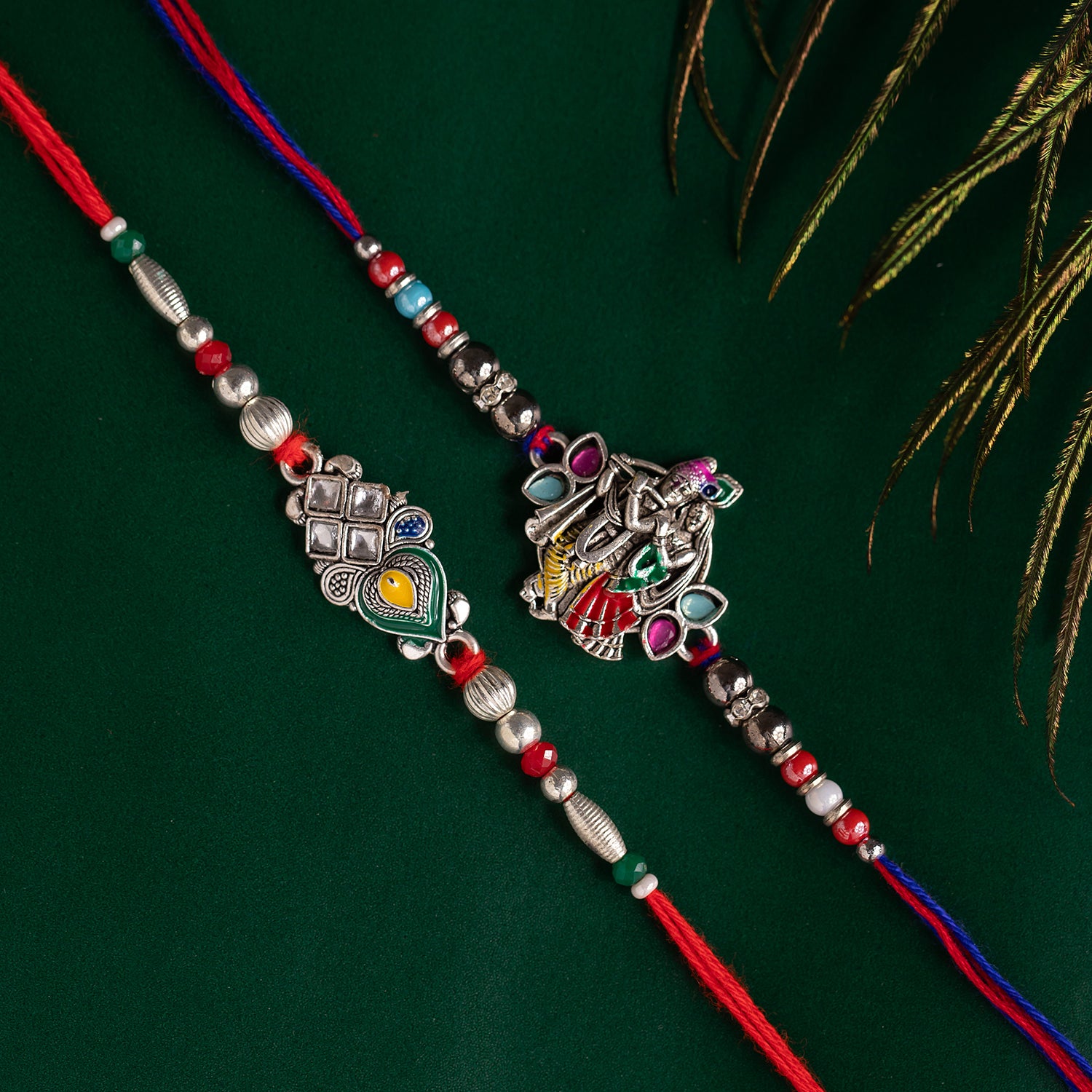 Traditional Radha Krishna and peacock feather rakhi combo for brother, symbolizing divine love and festive grace