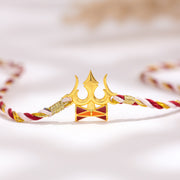 Divine Trishul Designer Brass Rakhi For Brother