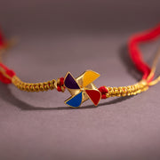 Nostalgic Pinwheel Designer Brass Rakhi For Brother