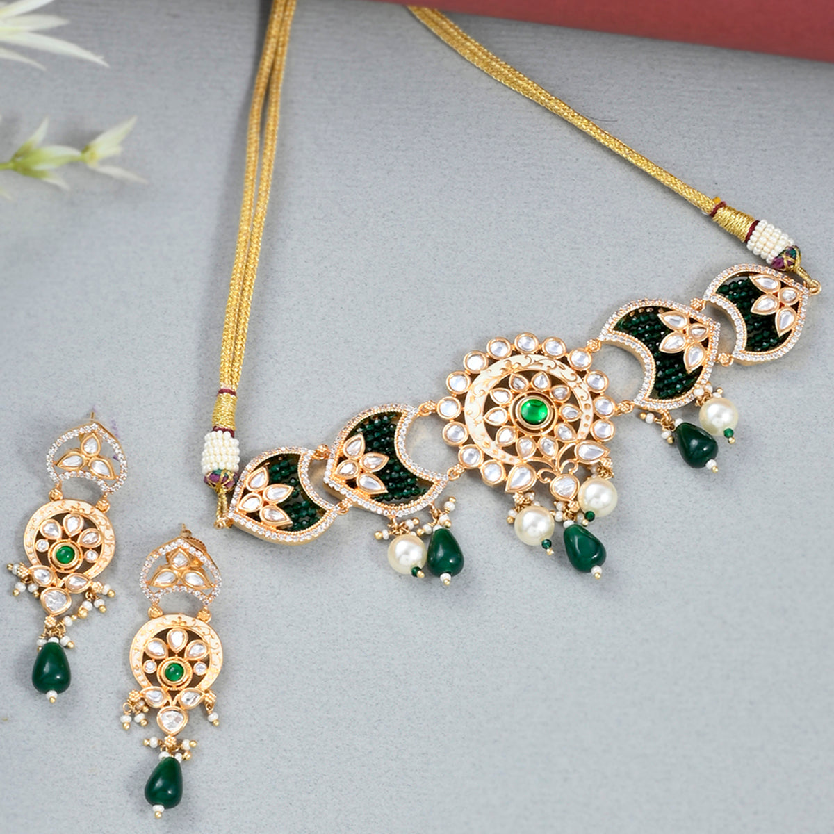 White Faux Pearls and Kundan Adorned Floral Gold Plated Brass Jewellery Set