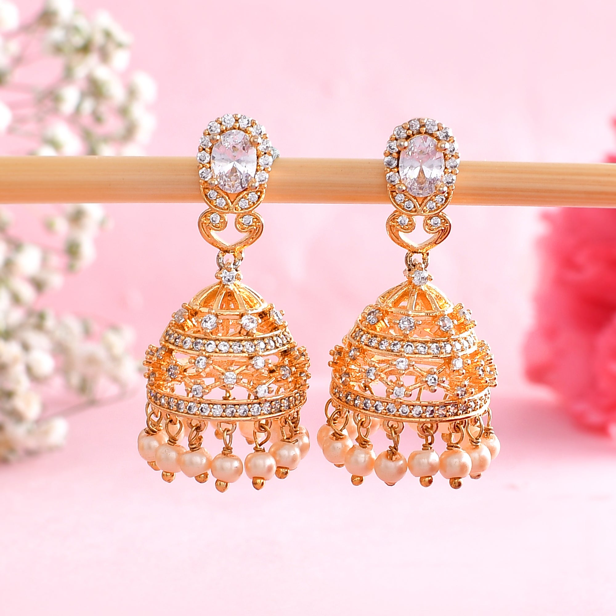 Look ethereal with this exquisite pair of earrings. Shop here: http://www. voylla.com/products/gold-tone-hoop-earring… | Traditional earrings, Pink cz,  Stone jewelry