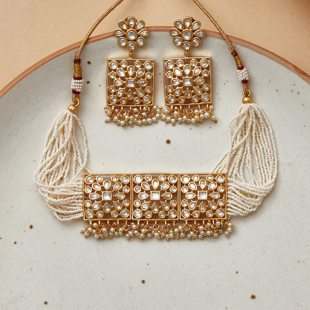 Cluster Setting Faux Kundan and White Pearls Adorned Gold Plated ...