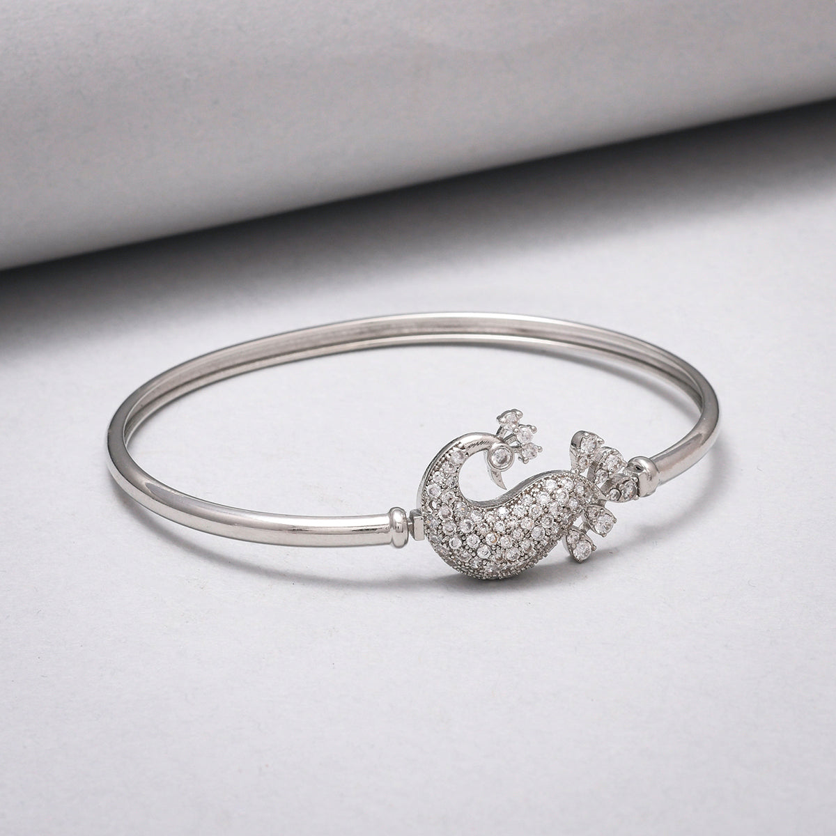 Sparkling Elegance Peacock Motif Zircons Adorned Brass Rhodium Plated Bracelet
