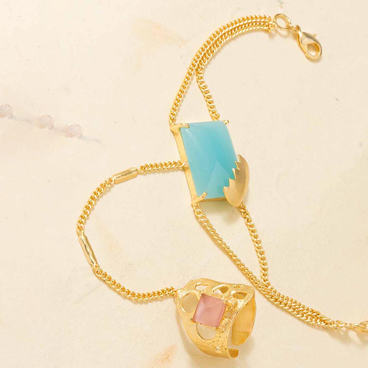 Gold Tone Slave Bracelet Decked With Pink-Blue Stone Embellishment
