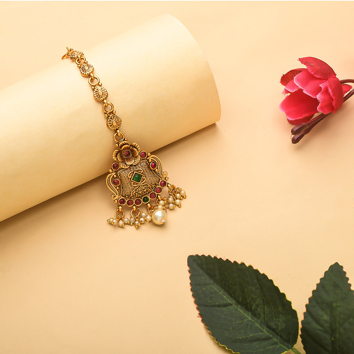 Faux Pearls and Kundan Adorned Opulent Yellow Gold Plated Brass Maang Tika