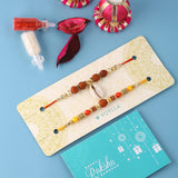 Set Of Two Spirtiual Rakhi With Roli Chaawal Pack