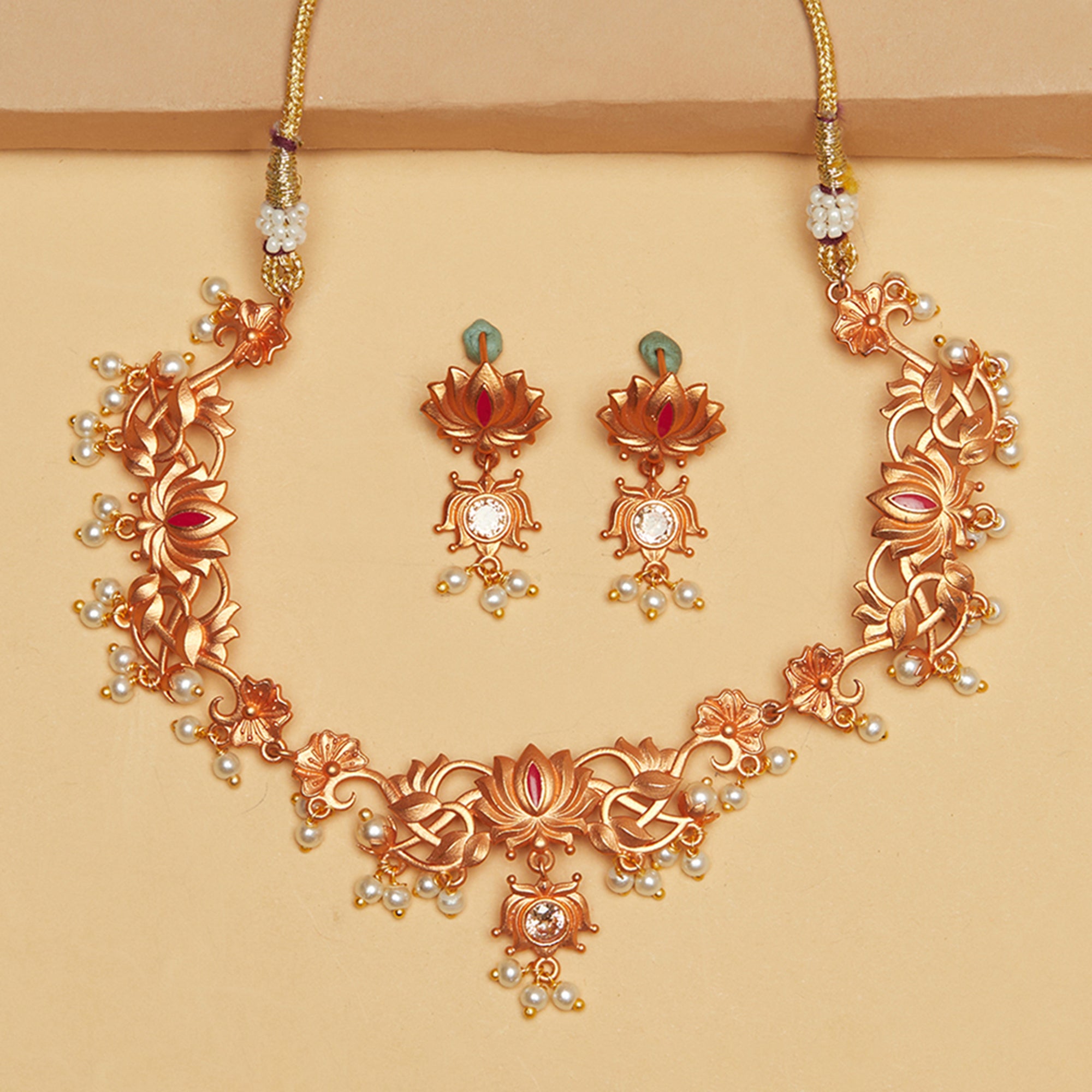 Apsara Antique Inspired Lotus Motifs Brass Rose Gold Plated Jewellery Set