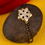 Shimmering Floret American Diamond CZ Golden Round Brass Black Beaded Bracelet